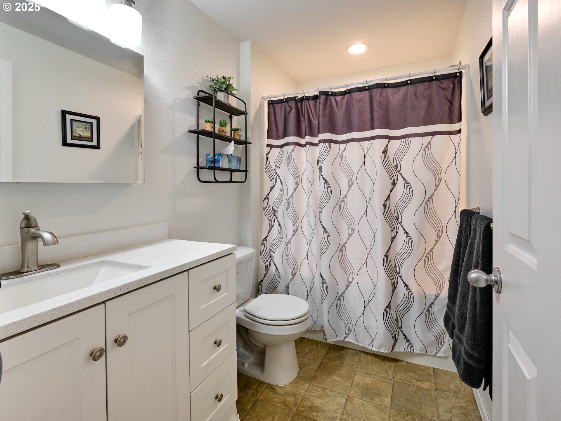 1353 Jodi Drive Silverton, OR 97381 - Photo 27 of 48 a bathroom with a granite countertop sink a toilet and a shower