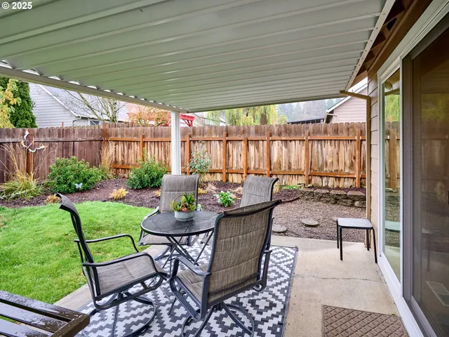 a balcony with chairs and a table