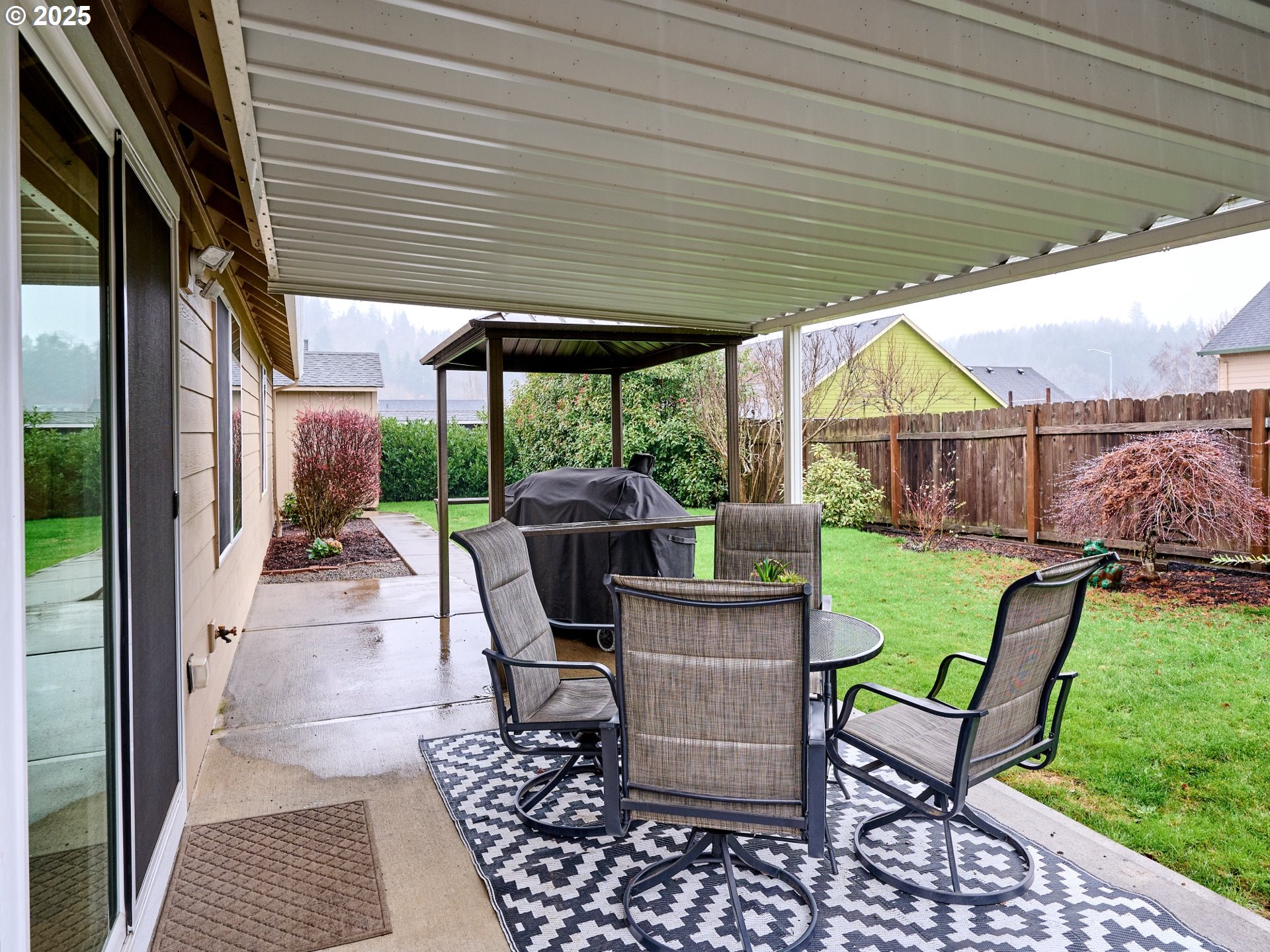 1353 Jodi Drive Silverton, OR 97381 - Photo 37 of 48 a view of a patio with a table chairs and a backyard