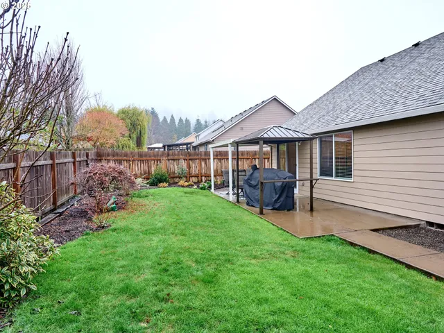 a view of a house with a yard porch and sitting area