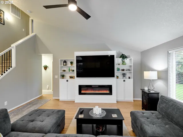 a living room with furniture and a flat screen tv