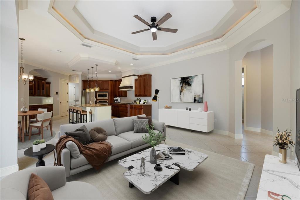 616 Crane Prairie Way Osprey, FL 34229 - Photo 13 of 54 a living room with furniture and kitchen view