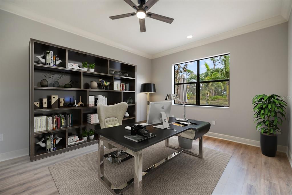 616 Crane Prairie Way Osprey, FL 34229 - Photo 16 of 54 a living room with furniture and a book shelf