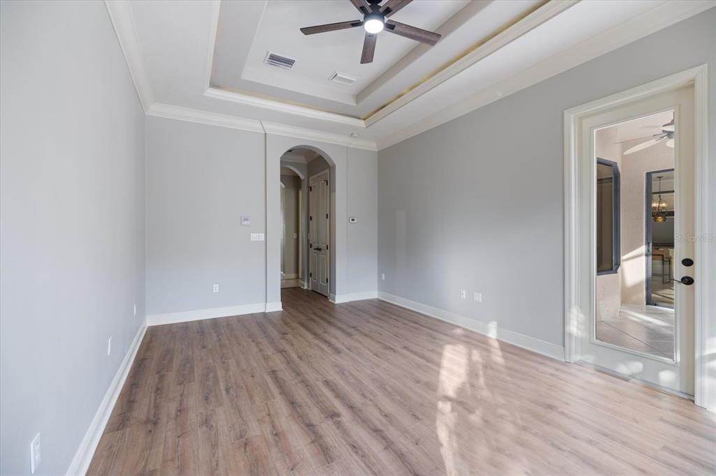 616 Crane Prairie Way Osprey, FL 34229 - Photo 21 of 54 wooden floor in an empty room with a window