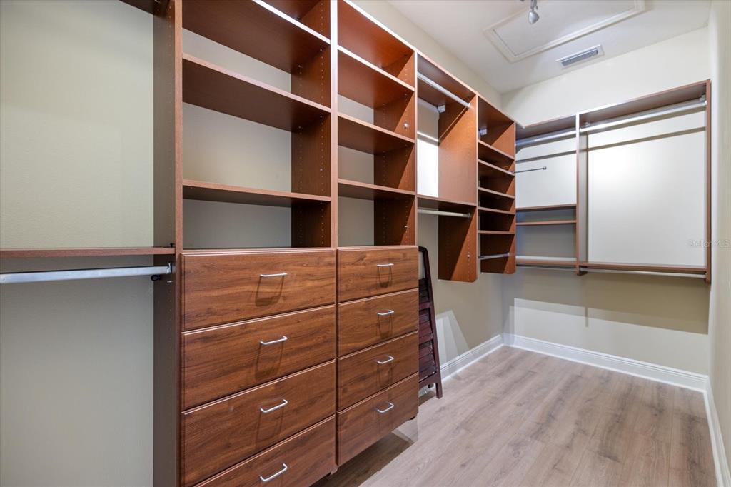 616 Crane Prairie Way Osprey, FL 34229 - Photo 22 of 54 a view of walk in closet with empty racks
