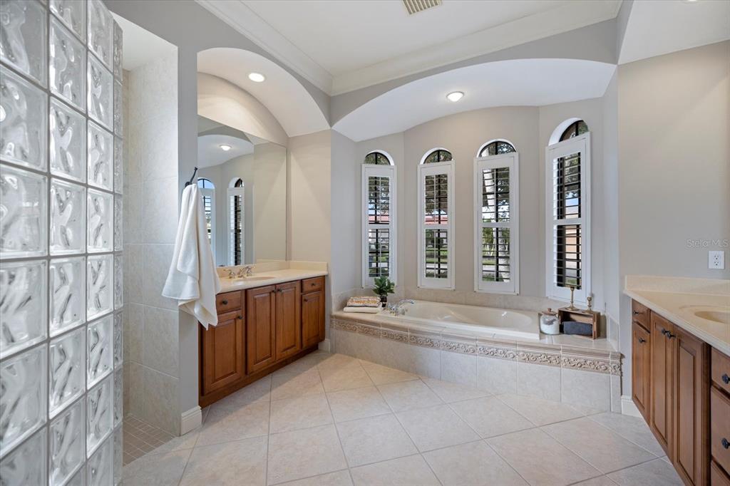 616 Crane Prairie Way Osprey, FL 34229 - Photo 23 of 54 a spacious bathroom with a tub sink and mirror