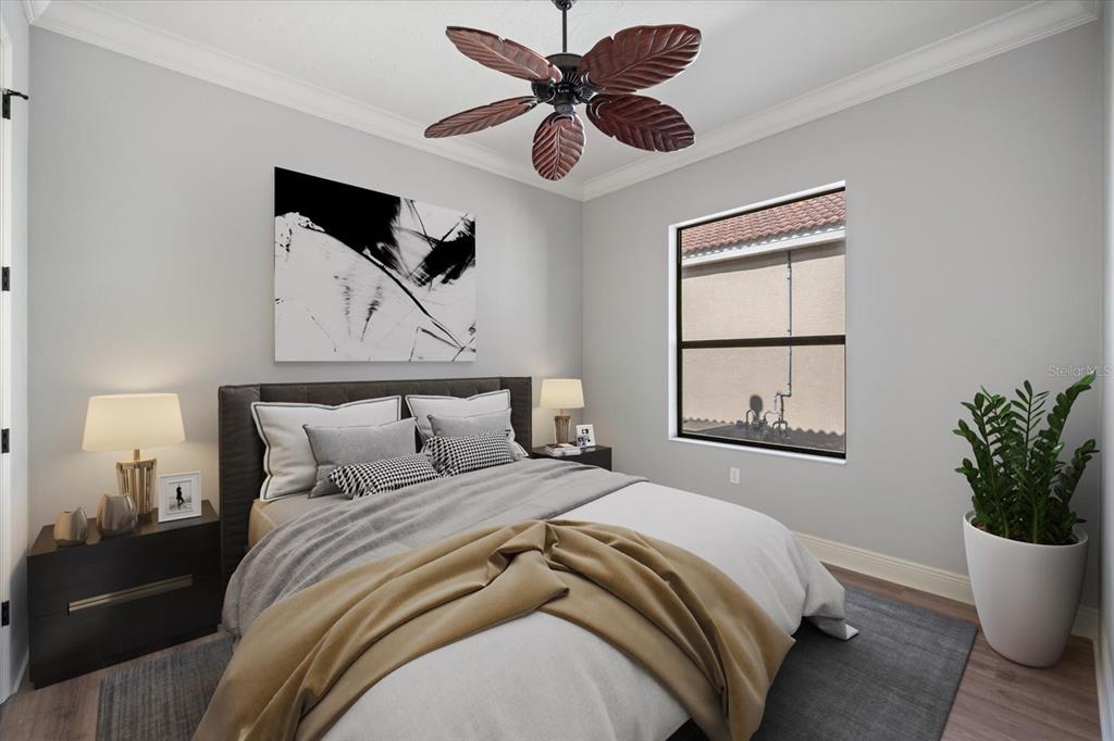 616 Crane Prairie Way Osprey, FL 34229 - Photo 28 of 54 a bedroom with bed and window