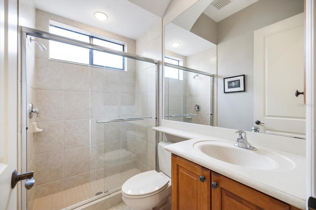 616 Crane Prairie Way Osprey, FL 34229 - Photo 29 of 54 a bathroom with a sink a toilet and shower