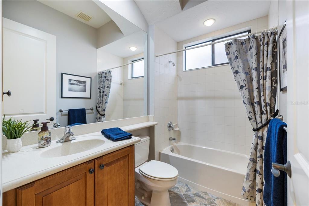 616 Crane Prairie Way Osprey, FL 34229 - Photo 32 of 54 a bathroom with a sink toilet tub and shower