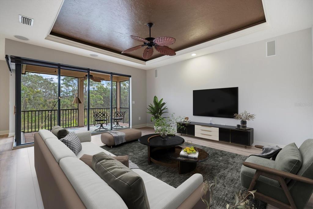 616 Crane Prairie Way Osprey, FL 34229 - Photo 34 of 54 a living room with furniture a flat screen tv and a large window