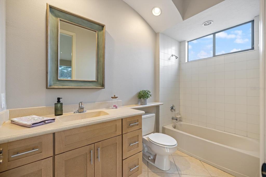 616 Crane Prairie Way Osprey, FL 34229 - Photo 39 of 54 a bathroom with a sink a toilet and shower