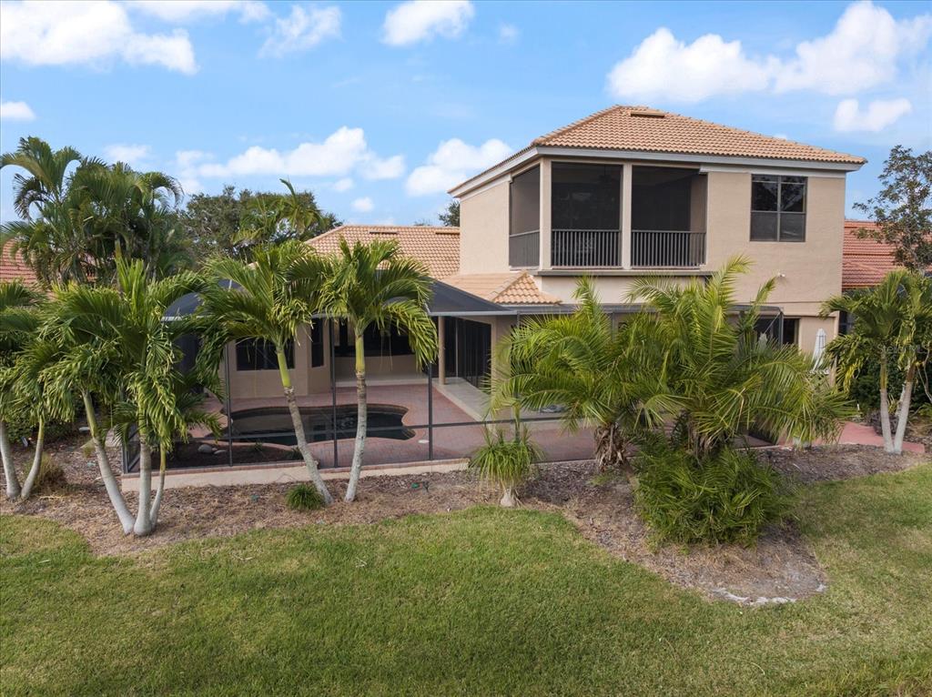 616 Crane Prairie Way Osprey, FL 34229 - Photo 4 of 54 a view of a house with a yard