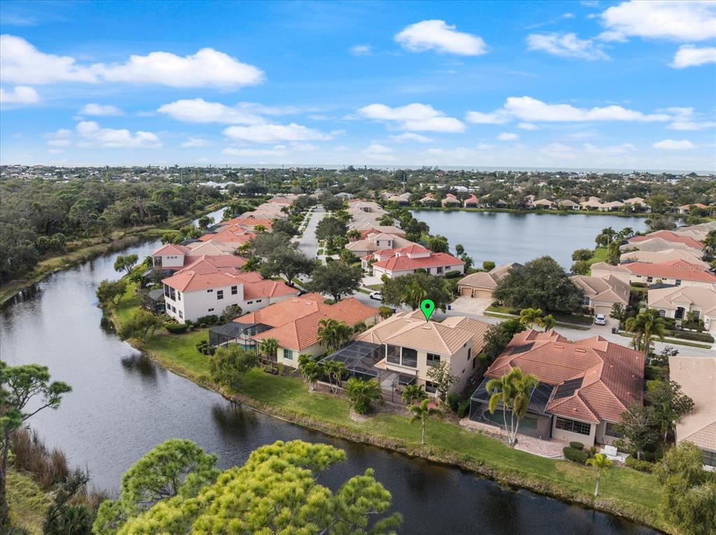 616 Crane Prairie Way Osprey, FL 34229 - Photo 54 of 54 an aerial view of residential houses with outdoor space and lake view