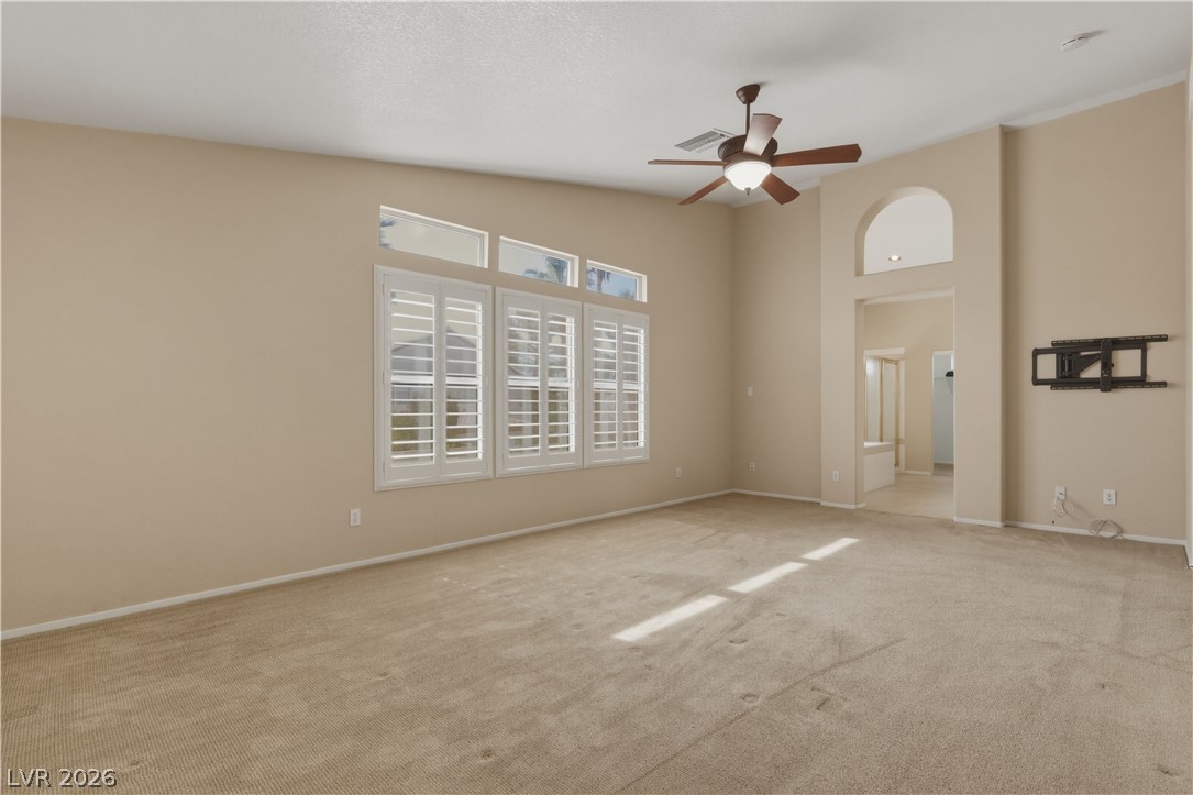 29 Olive Tree Henderson, NV 89074 - Photo 29 of 60 Bright and airy, this room features carpet flooring and elegant window shutters.