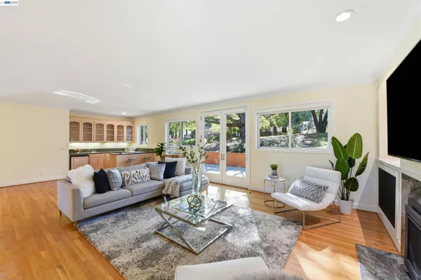 a living room with furniture and a large window