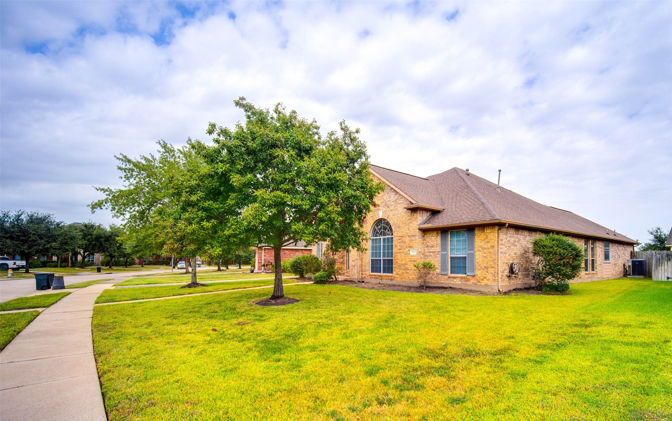 9323 Hillhaven Court Rosenberg, TX 77469 - Photo 2 of 37 a front view of house with yard and trees around