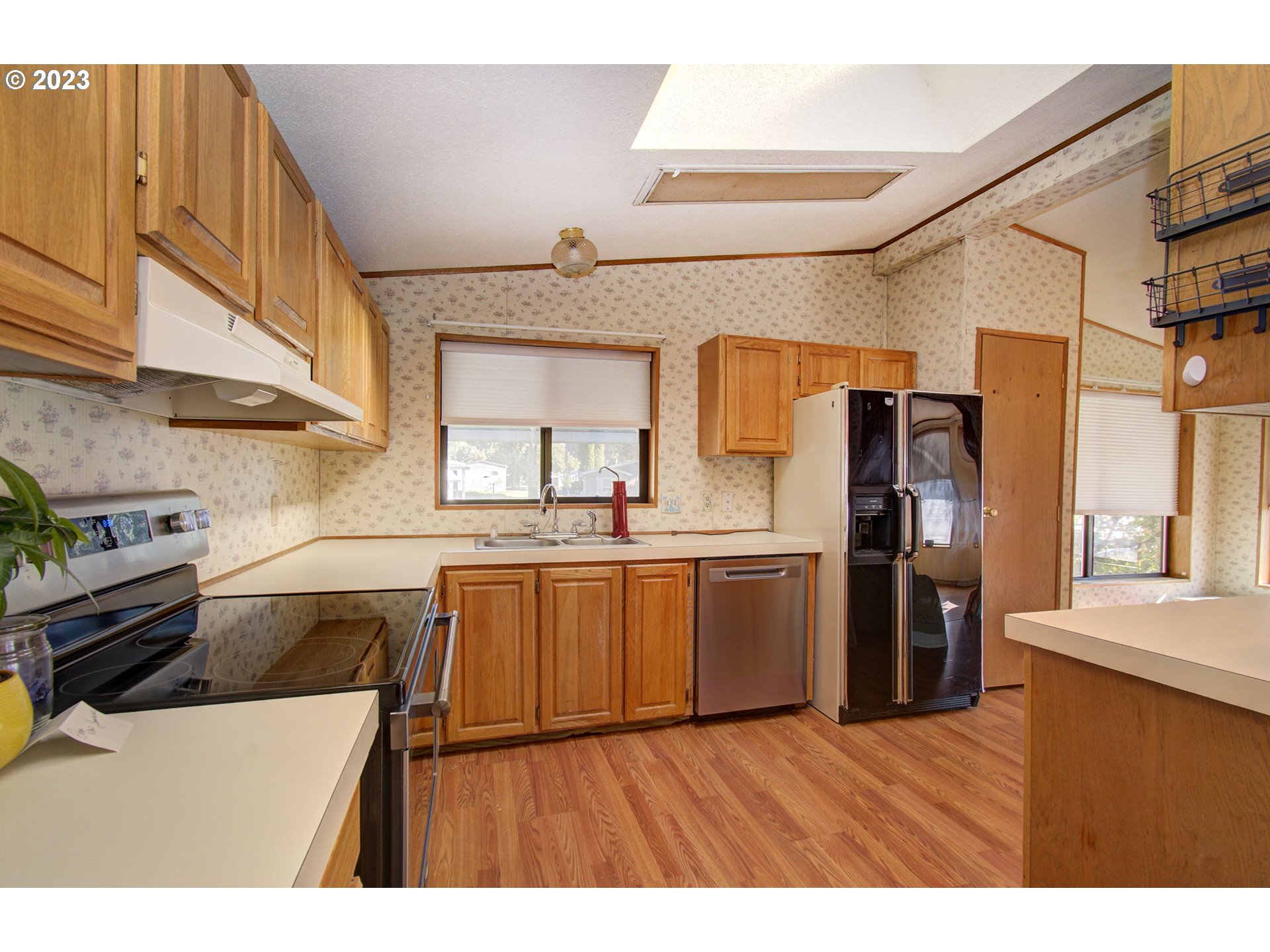 15619 Northeast Caples Road Brush Prairie, WA 98606 - Photo 11 of 27 a kitchen with a sink and refrigerator