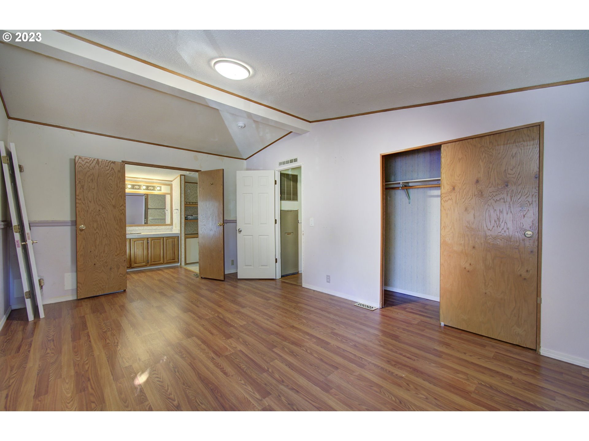 15619 Northeast Caples Road Brush Prairie, WA 98606 - Photo 22 of 27 a view of an empty room with wooden floor and a window