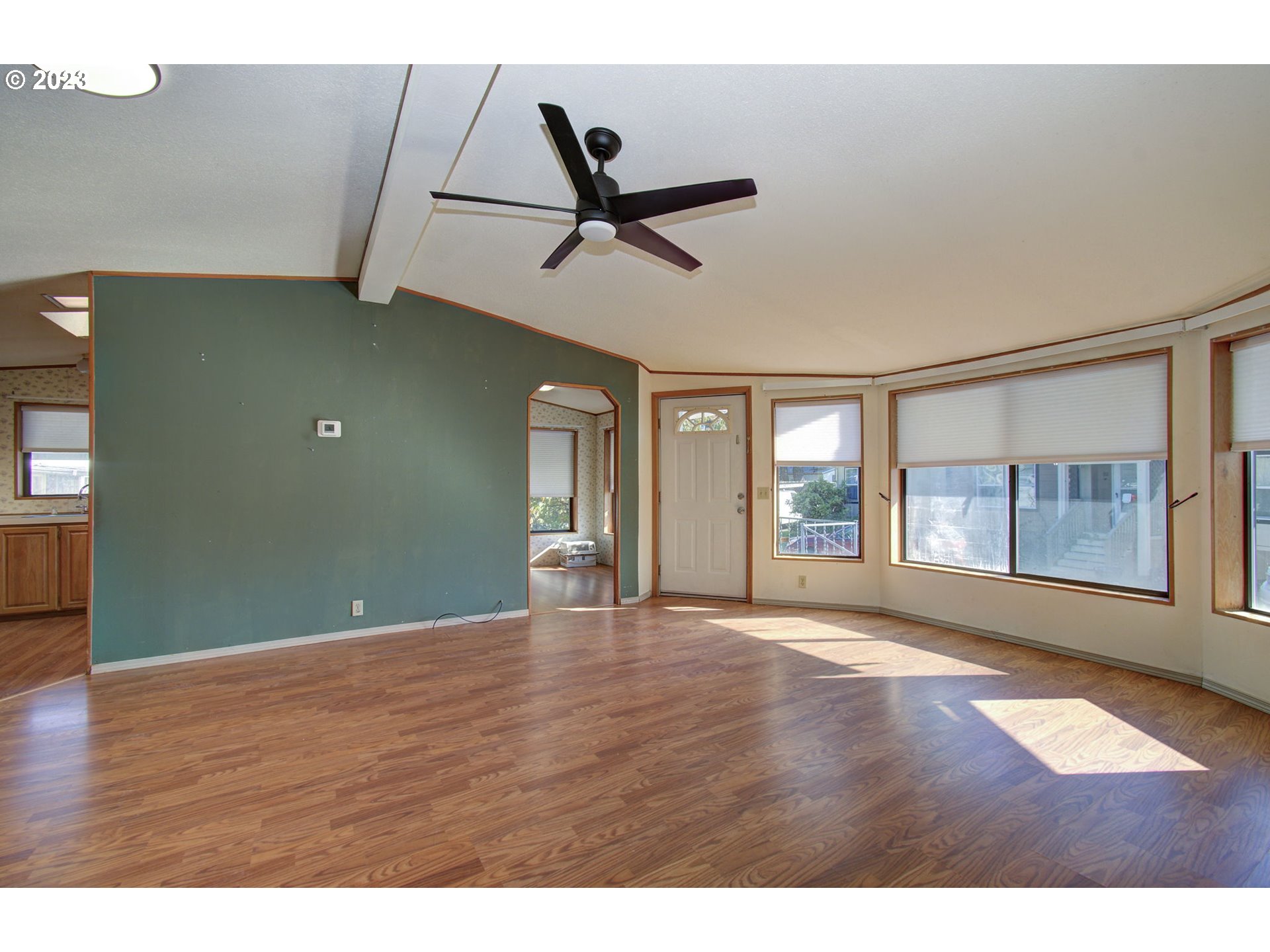 15619 Northeast Caples Road Brush Prairie, WA 98606 - Photo 3 of 27 a view of an empty room with wooden floor and a window