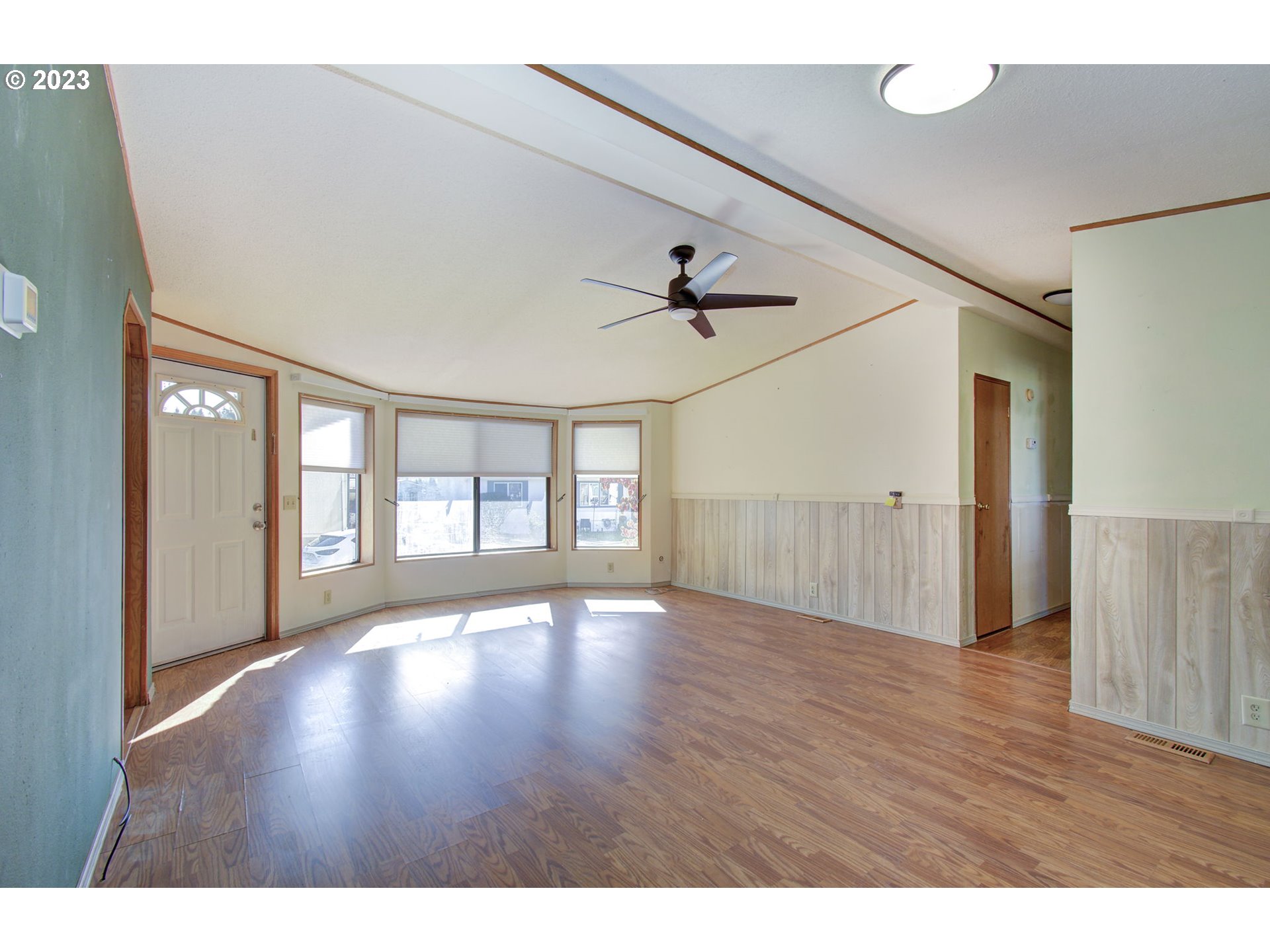 15619 Northeast Caples Road Brush Prairie, WA 98606 - Photo 4 of 27 a view of an empty room with wooden floor and a window