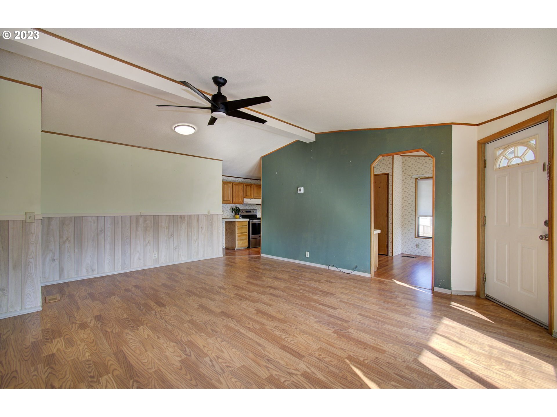 15619 Northeast Caples Road Brush Prairie, WA 98606 - Photo 5 of 27 a view of a livingroom with a ceiling fan and hardwood floor