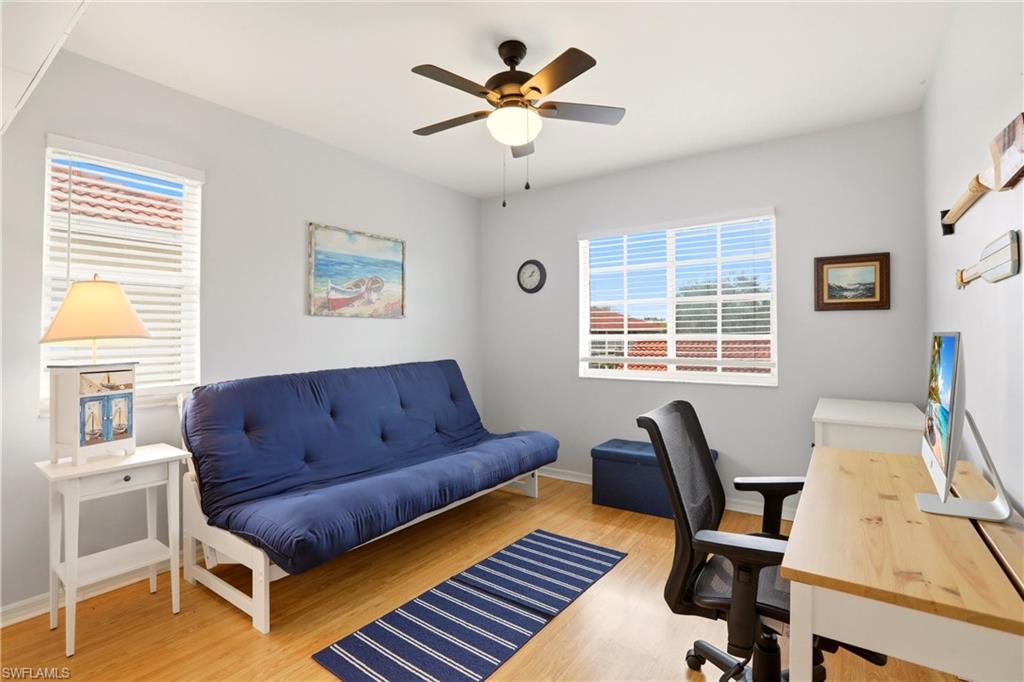 1723 Reuven Circle, Unit 2004 Naples, FL 34112 - Photo 14 of 29 a living room with furniture and a window