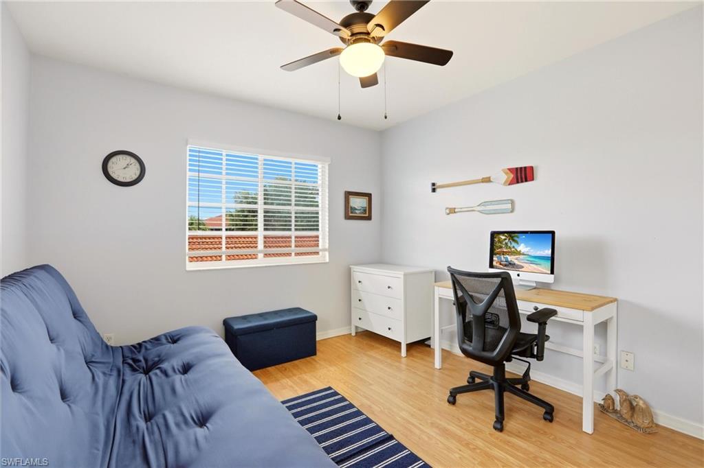 1723 Reuven Circle, Unit 2004 Naples, FL 34112 - Photo 15 of 29 a workspace with furniture hardwood and a window