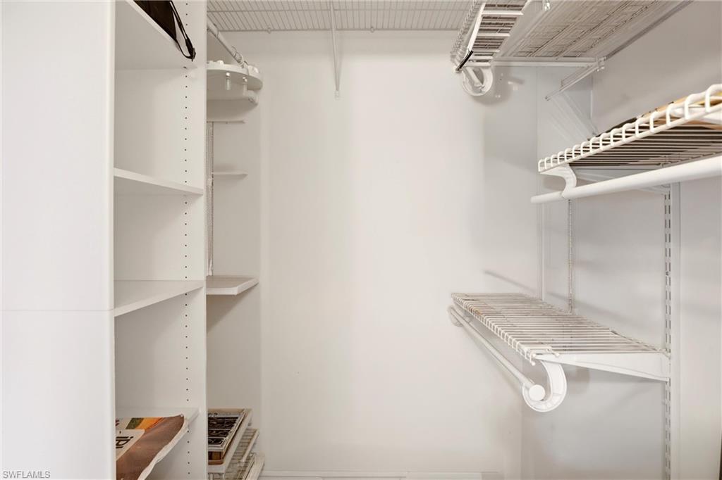 1723 Reuven Circle, Unit 2004 Naples, FL 34112 - Photo 21 of 29 a view of a room with racks on the wall