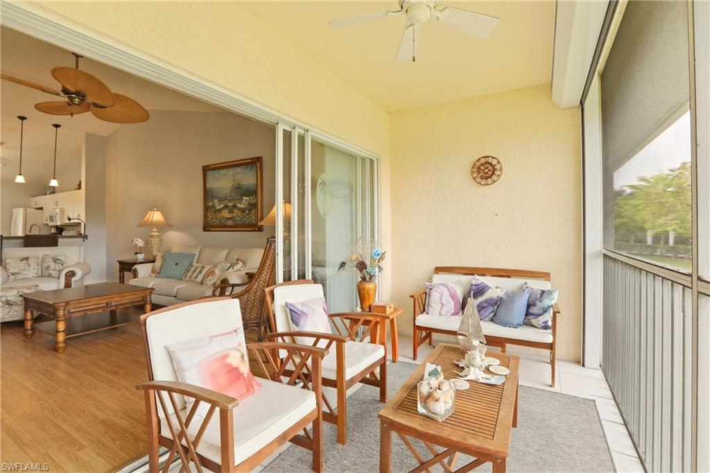 1723 Reuven Circle, Unit 2004 Naples, FL 34112 - Photo 23 of 29 a living room with furniture and a window