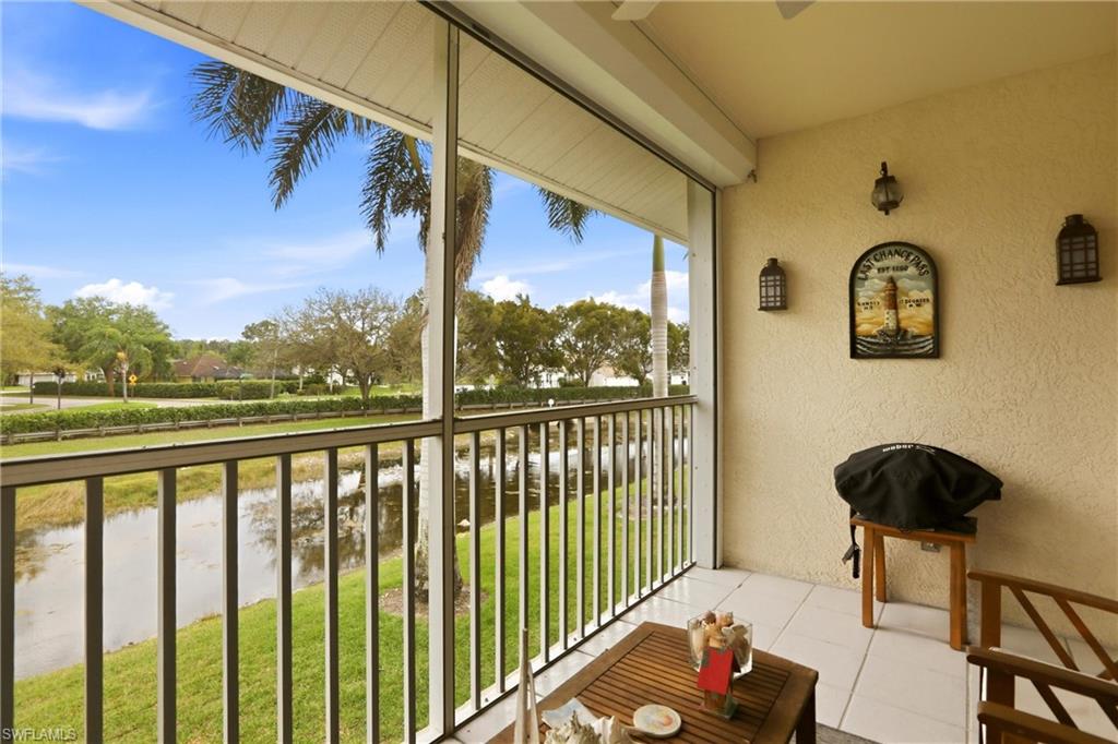 1723 Reuven Circle, Unit 2004 Naples, FL 34112 - Photo 26 of 29 a view of a chairs and table in a balcony