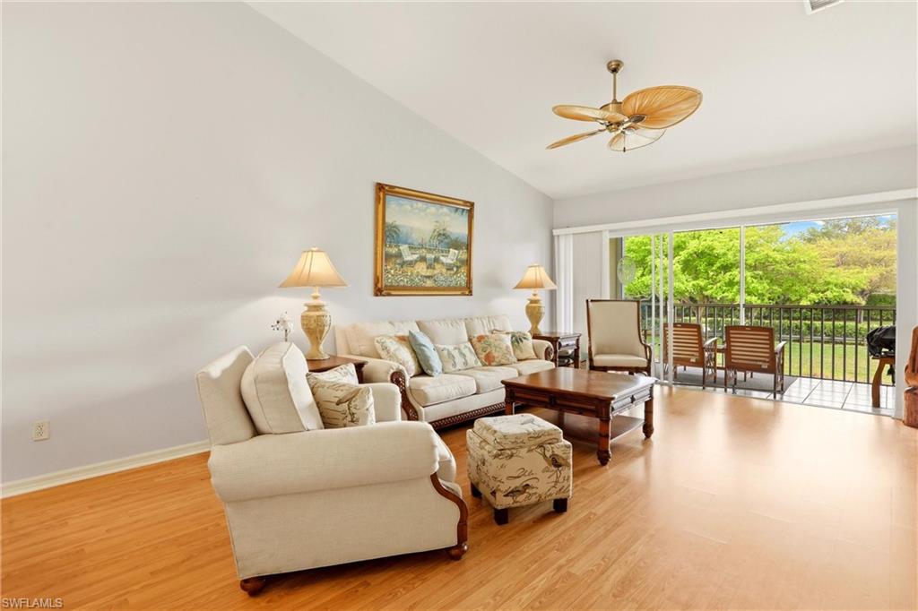 1723 Reuven Circle, Unit 2004 Naples, FL 34112 - Photo 3 of 29 a living room with furniture and a large window