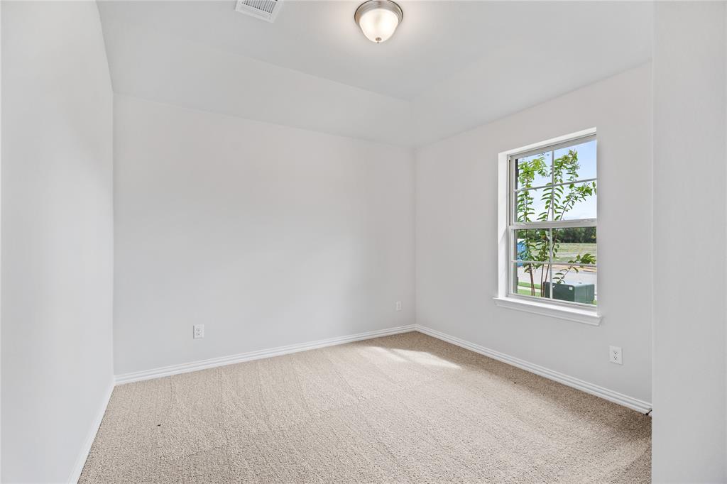 2608 Freeman Street Anna, TX 75409 - Photo 21 of 22 an empty room with a window