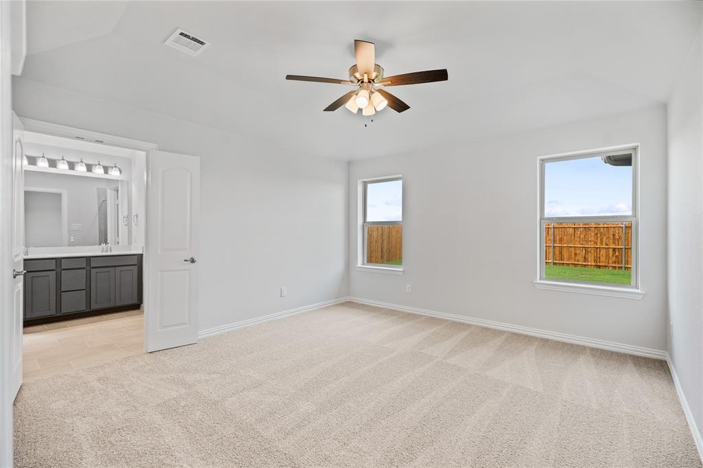 2608 Freeman Street Anna, TX 75409 - Photo 17 of 22 a view of a livingroom with a ceiling fan and window