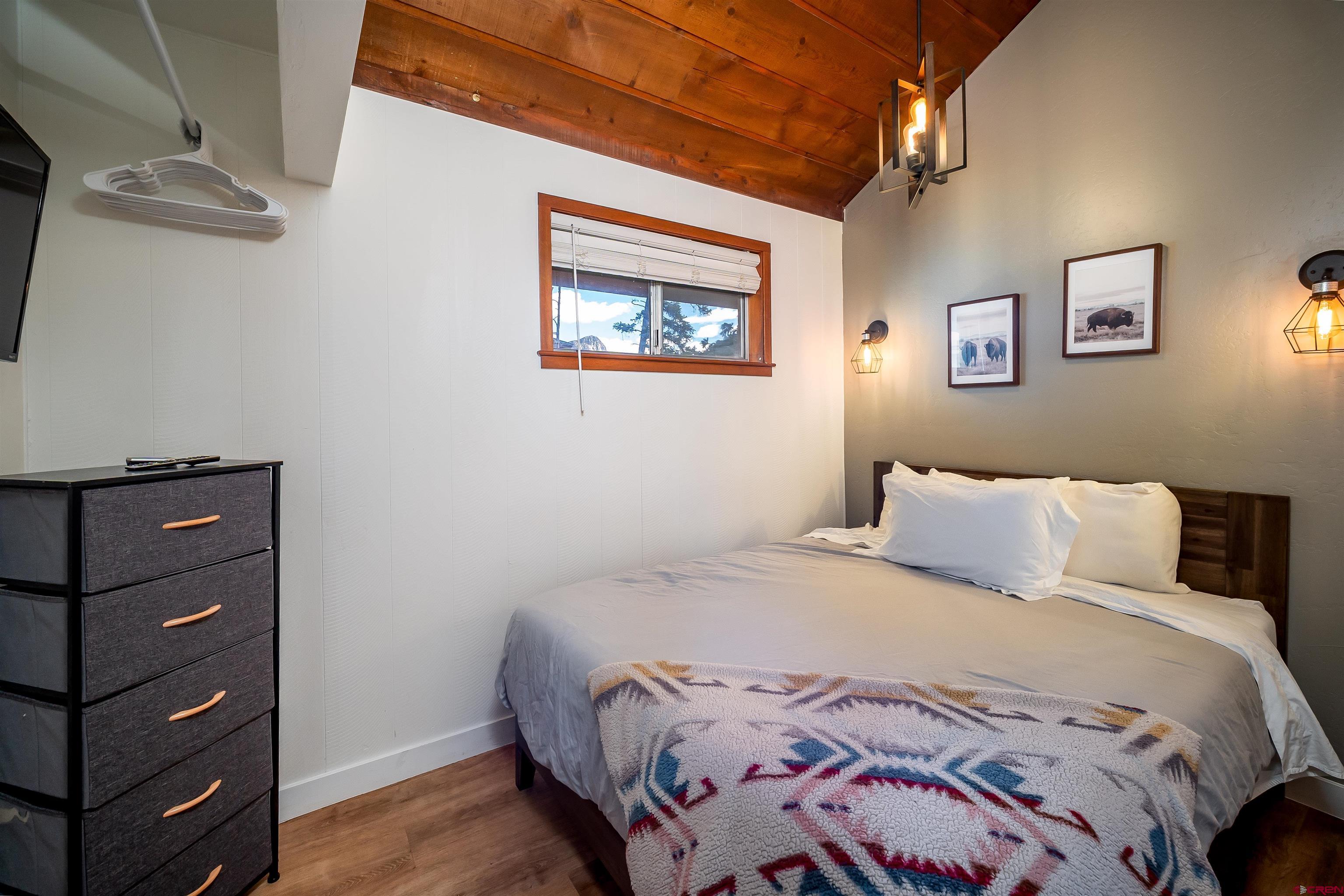 44 Sheol Street, Unit A22 Durango, CO 81301 - Photo 15 of 34 a bedroom with a bed and a window
