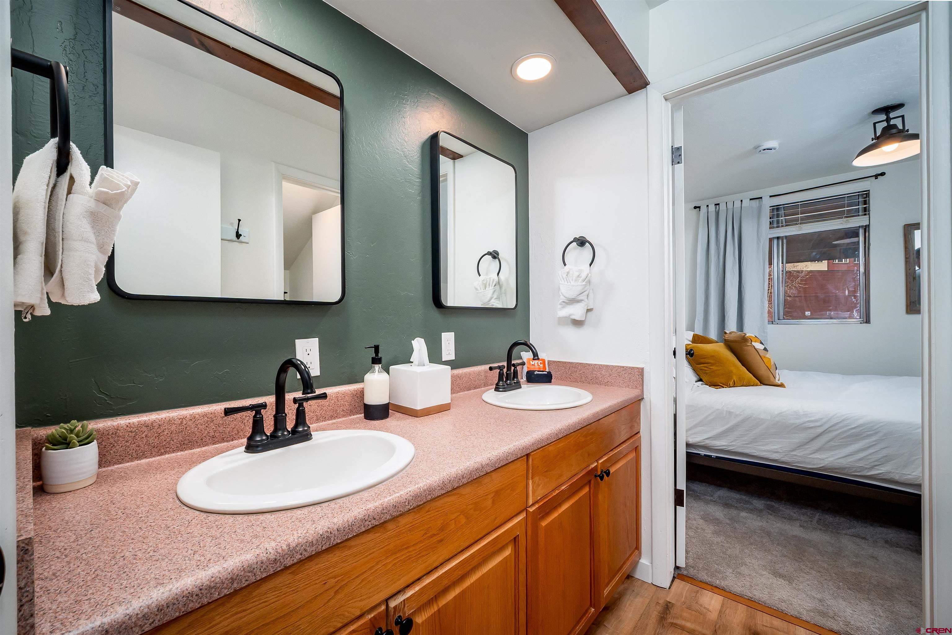 44 Sheol Street, Unit A22 Durango, CO 81301 - Photo 20 of 34 a bathroom with a double vanity sink and a mirror