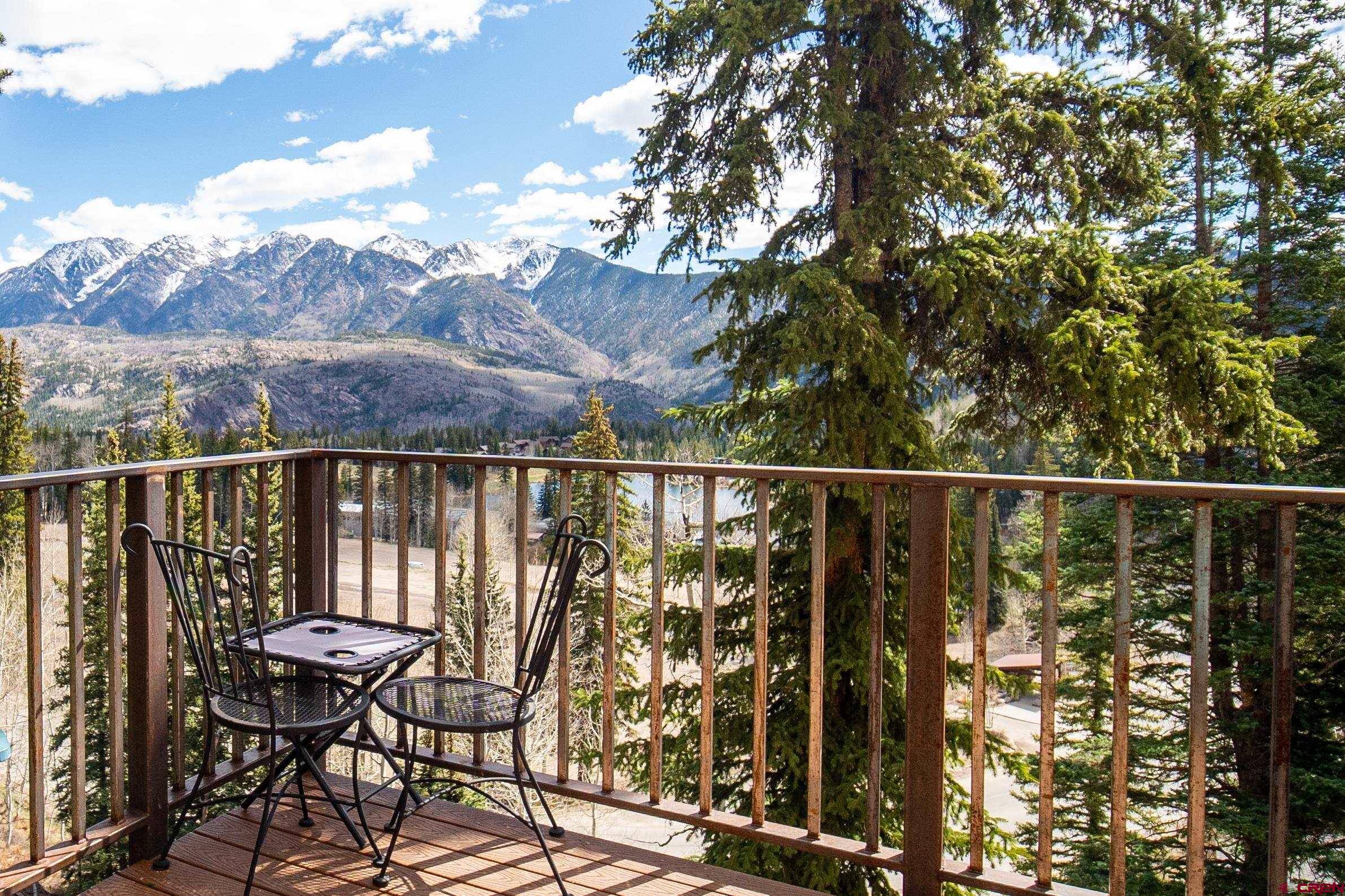 44 Sheol Street, Unit A22 Durango, CO 81301 - Photo 3 of 34 a view of a balcony with chairs and wooden fence