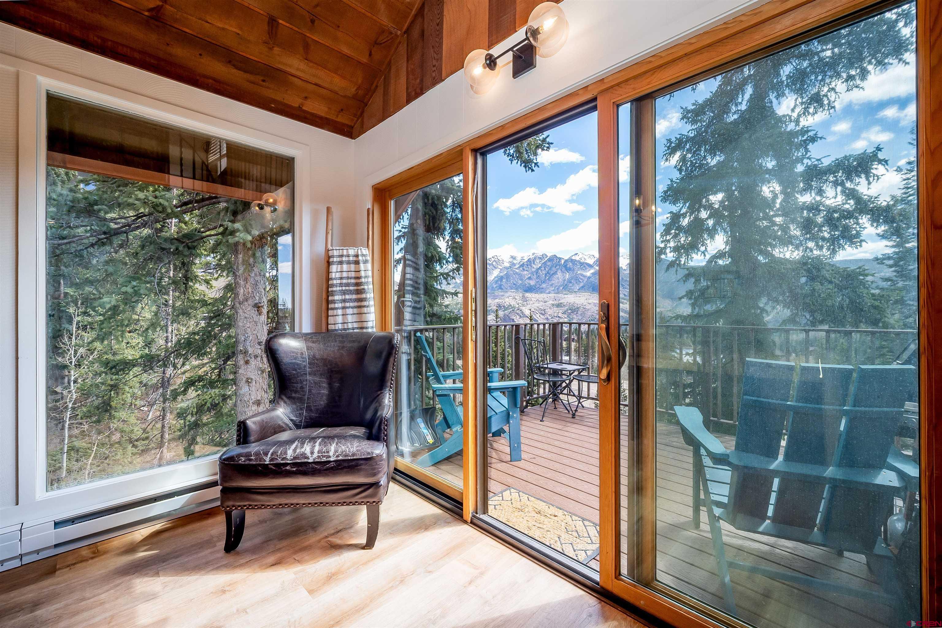 44 Sheol Street, Unit A22 Durango, CO 81301 - Photo 5 of 34 a living room with furniture and a floor to ceiling window