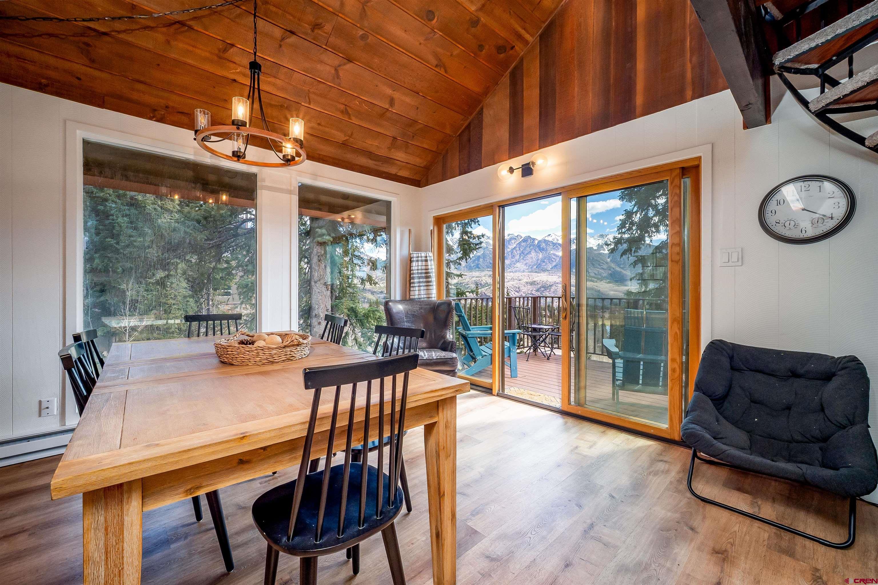 44 Sheol Street, Unit A22 Durango, CO 81301 - Photo 6 of 34 a dining room with furniture a chandelier and a large window