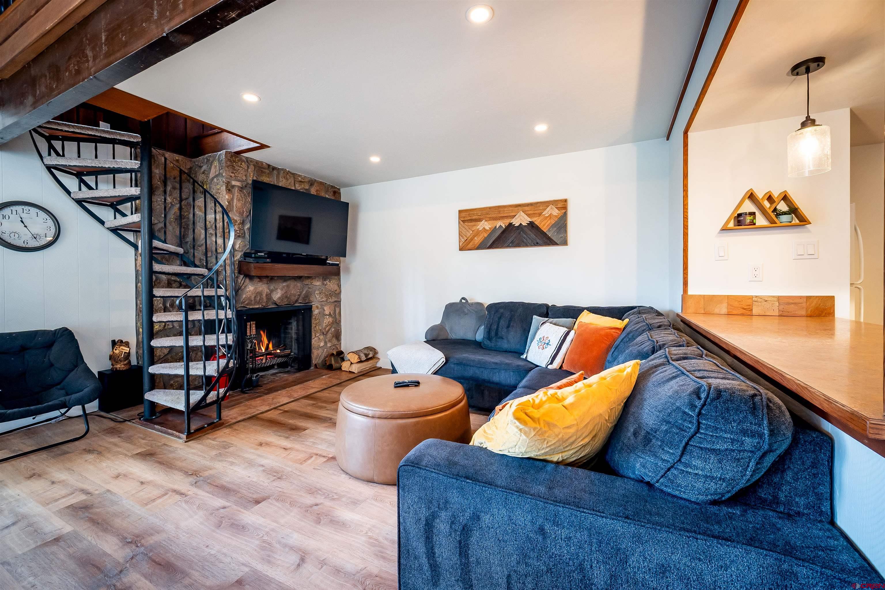 44 Sheol Street, Unit A22 Durango, CO 81301 - Photo 9 of 34 a living room with furniture and a fireplace