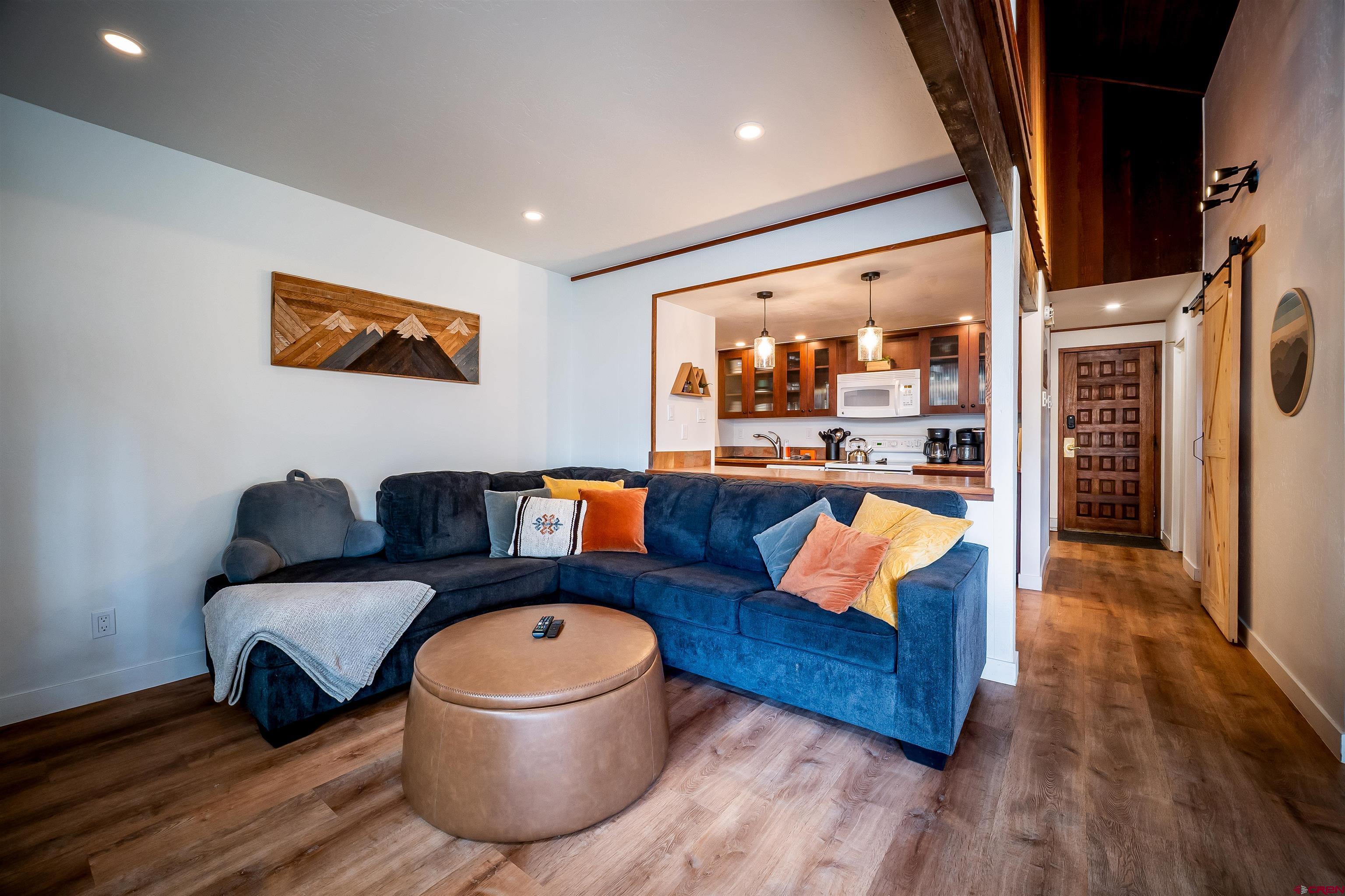 44 Sheol Street, Unit A22 Durango, CO 81301 - Photo 10 of 34 a living room with furniture and wooden floor