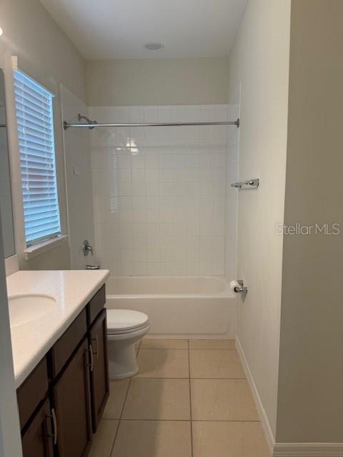 7231 Shadeview Alley Windermere, FL 34786 - Photo 15 of 22 a bathroom with a sink a toilet and shower