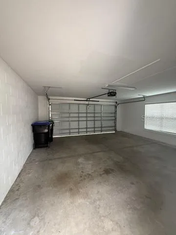 a view of a house with yard and sitting area