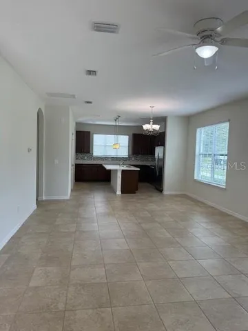 a view of kitchen with furniture and window