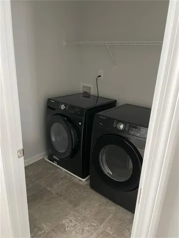 a utility room with dryer and washer