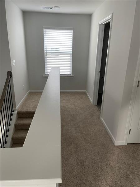 92 Shelter Lane East Dawsonville, GA 30534 - Photo 12 of 19 a view of a hallway with windows