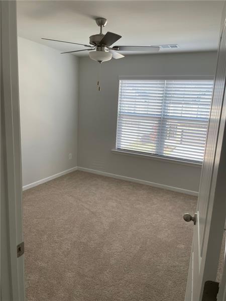 92 Shelter Lane East Dawsonville, GA 30534 - Photo 16 of 19 a view of a livingroom with a ceiling fan and window