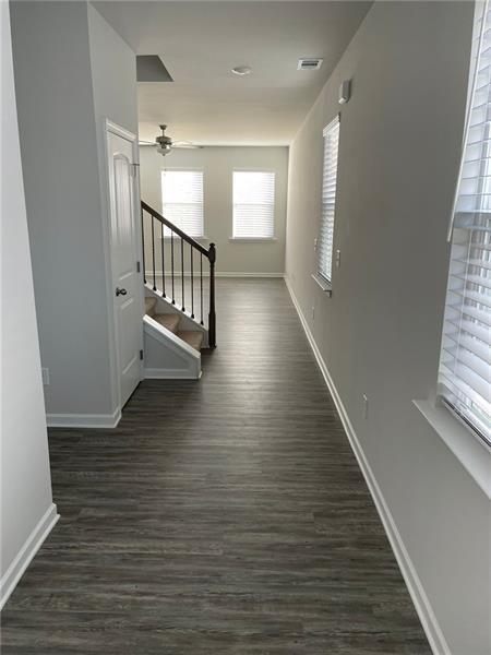 92 Shelter Lane East Dawsonville, GA 30534 - Photo 2 of 19 an empty room with wooden floor and windows