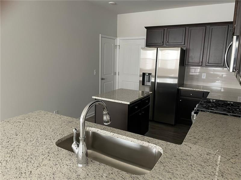 92 Shelter Lane East Dawsonville, GA 30534 - Photo 8 of 19 a kitchen with a refrigerator and a stove