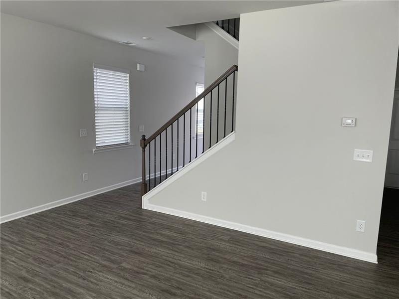 92 Shelter Lane East Dawsonville, GA 30534 - Photo 9 of 19 an empty room with wooden floor and windows