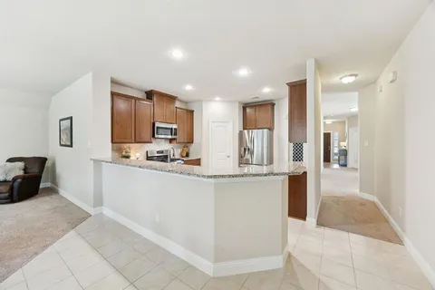 a bedroom with a bed dresser and a window